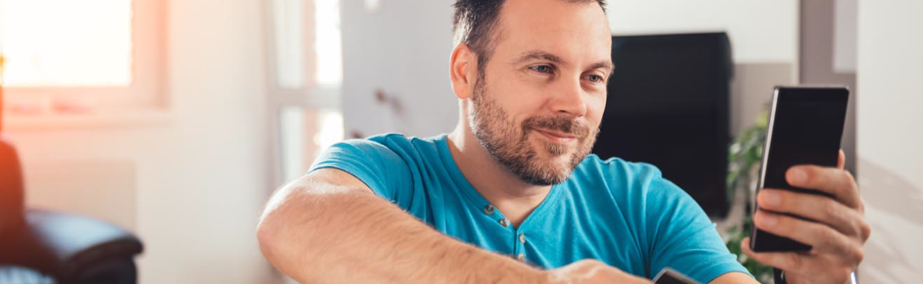 A man checking his smart phone